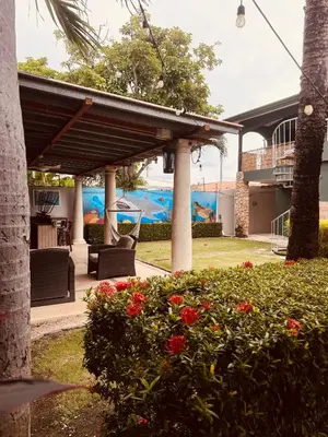 a house with a patio with a view of the ocean at Jaco Sol Quadplex 11A in Jacó