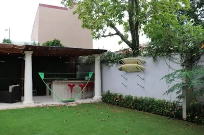 a fence with a painting of a car on it at 11B Jaco Sol Quadplex in Jacó