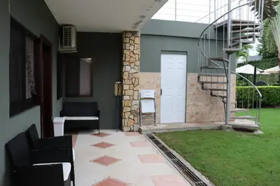 a room with a staircase and a white door at 11B Jaco Sol Quadplex in Jacó