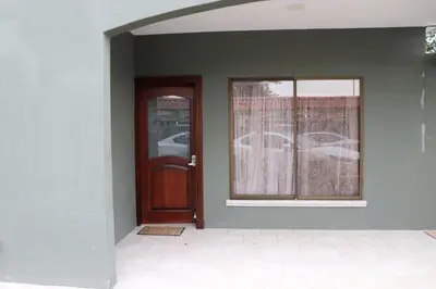 an empty room with a door and a window at 11B Jaco Sol Quadplex in Jacó