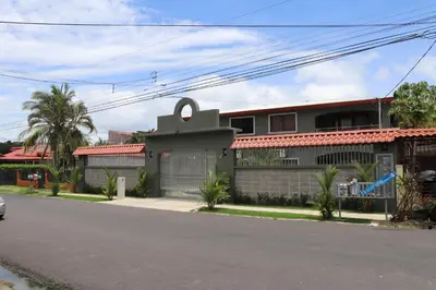 a house on the side of a street at 11B Jaco Sol Quadplex in Jacó