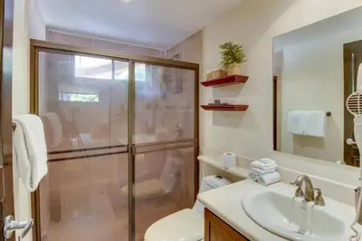 a bathroom with a shower and a sink at The Cove at Playa Ocotal, units 5,6,7 and 8 in Coco