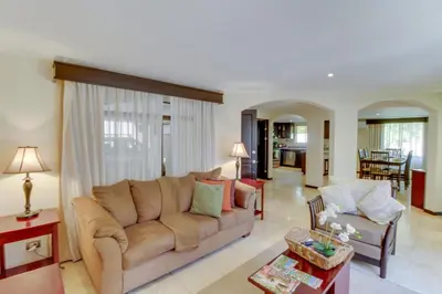 a living room with a couch and a table at The Cove at Playa Ocotal, units 5,6,7 and 8 in Coco