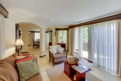a living room with a couch and a table at The Cove at Playa Ocotal, units 5,6,7 and 8 in Coco