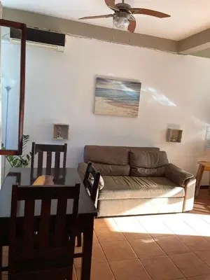 a living room with a couch and a table at Casa Sueno Colibri in Tamarindo