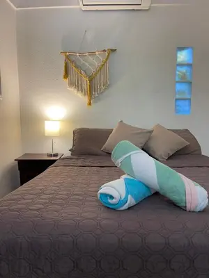 a bedroom with a bed with a towel on it at Casa del Sol in Tamarindo