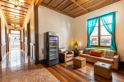 a living room with a soda machine in a room at ALAJUELA CITY Hotel & Guest House in Alajuela City