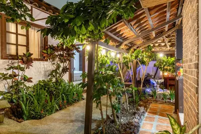 an indoor garden with plants in a building at ALAJUELA CITY Hotel & Guest House in Alajuela City