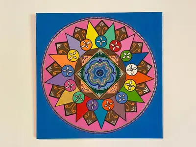 a colorful mandala painting on a wall at Casa Colores in Montezuma