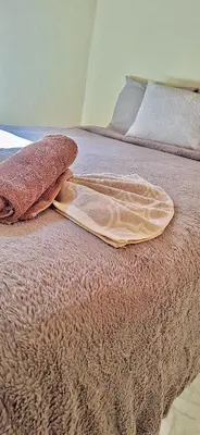 a bed with a tray on top of it at Alojamientos Norte y Sur in Monteverde Costa Rica