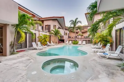 an exterior view of a house with a swimming pool at The Cove 3/4 in Coco