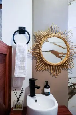 a bathroom with a mirror and a sink at Sueño Río Celeste Boutique B&B in Bijagua