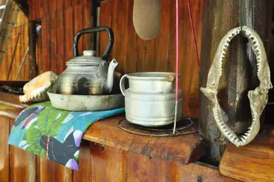 a table with a tea kettle and other items on it at Howler Monkey Hotel in Montezuma