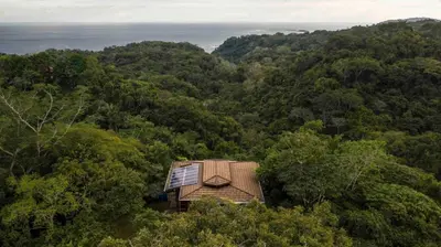 a small house in the middle of a forest at Private Home in Montezuma with Ocean View in Montezuma