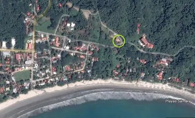a map of a beach with a green spot at Casa La Guaria in Sámara