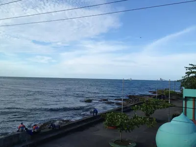 a view of the ocean from the balcony of a building at Park Hotel in Puerto Limón
