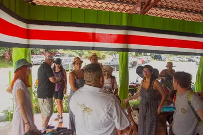 a group of people standing under a tent at Hotel El Icaco Tortuguero in Tortuguero