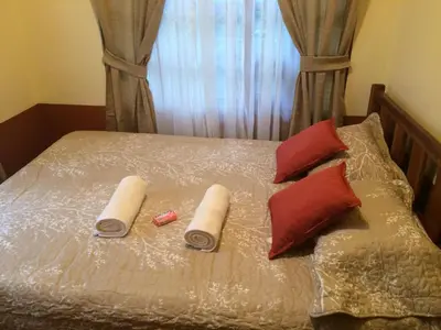 a bed with two pillows at Casa entre la naturaleza in San Marcos