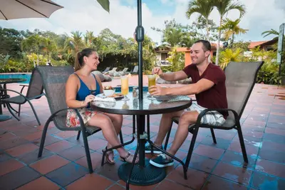 a man and a woman sitting at a table at Casa Luna Hotel & Spa in Fortuna