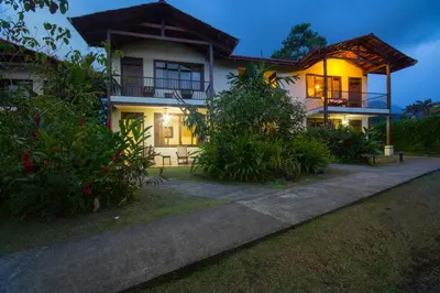 a house with the lights on at night at Casa Luna Hotel & Spa in Fortuna