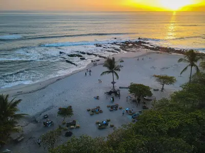 an aerial view of a beach at sunset at Hotel Nantipa - A Tico Beach Experience in Santa Teresa Beach