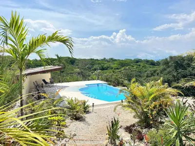 a swimming pool in the middle of a resort at Villas Roma Del Mar in Playa Naranjo