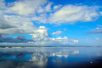 a large body of water with a blue sky and clouds at Beso del Viento (Adults Only) in Parrita