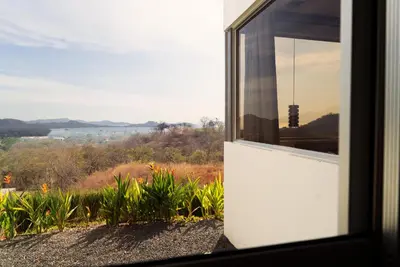 a window of a house with a view of the countryside at Horizon Lodge Potrero in Potrero