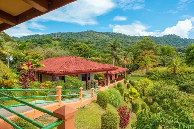 a house with a view of a garden at Villas Alturas in Dominical