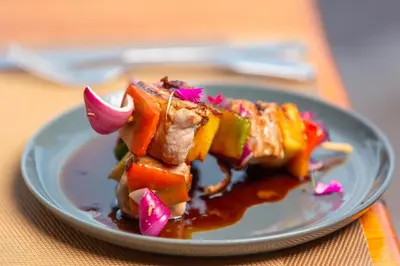 a plate of food with vegetables on a table at Villas Alturas in Dominical