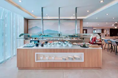 a store with a counter with vases on it at AC Hotel by Marriott San Jose Escazu in San José