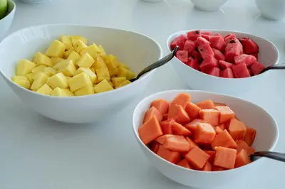 three bowls of fruit in bowls with fruit in them at AC Hotel by Marriott San Jose Escazu in San José