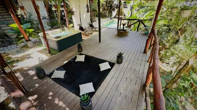 an overhead view of a wooden deck with a bath tub at Canaima Chill House in Santa Teresa Beach