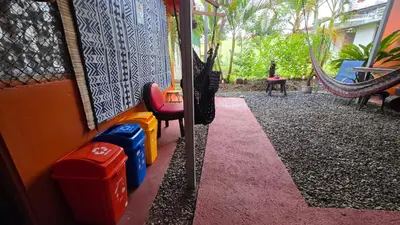 a room with a playground with chairs and a hammock at Alojamientos N&S in Fortuna