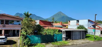 a town with a mountain in the background at Alojamientos N&S in Fortuna
