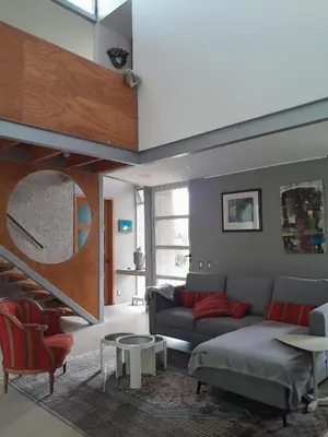 a living room with a couch and a table at Casa Nadette in Guácima