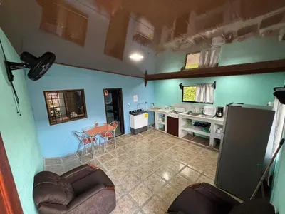 an aerial view of a kitchen and a living room at Pura Vida Aparment - Downtown La Fortuna in Fortuna