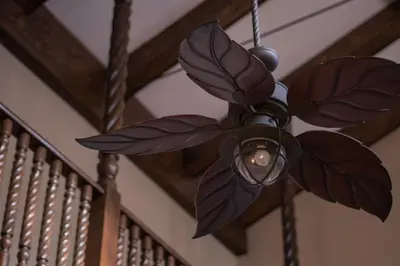 a chandelier hanging from a wooden ceiling at Hotel Casa Colon in San José