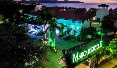 an aerial view of a mansion at night at Margaritaville Beach Resort Playa Flamingo in Playa Flamingo