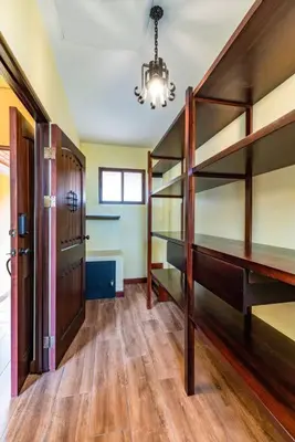 a room with a bunk bed and a hallway at Villa El Retiro Luxury Property in Alajuela City