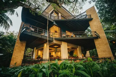 a building with balconies on the side of it at Hotel Bosque del Mar Playa Hermosa in Playa Hermosa