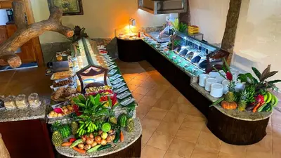 an overhead view of a buffet with fruits and vegetables at Hotel Los Lagos Spa & Resort in Fortuna