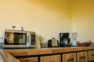 a microwave sitting on top of a kitchen counter at Moon Forest Apartments in Monteverde Costa Rica