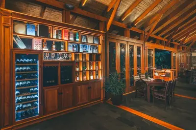 a room with a wine cellar with a table and a shelf at Amor Arenal Adults Friendly in Fortuna