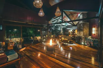 a restaurant with a table in the middle of a room at El Silencio Lodge & Spa Costa Rica in Toro Amarillo
