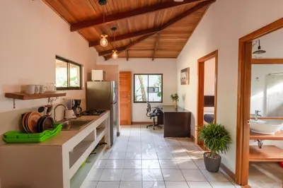 a kitchen with a sink and a counter top at Casas Santa Teresa in Santa Teresa Beach