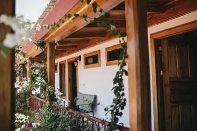 a balcony of a house with flowers on it at Hotel Javy in Liberia