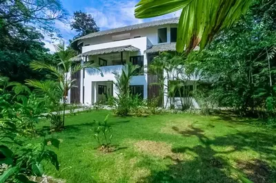 a view of the house from the garden at Makara Mono Suite / 2nd Floor in Uvita