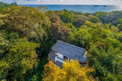 an aerial view of a house in the forest at Makara Mono Suite / 2nd Floor in Uvita