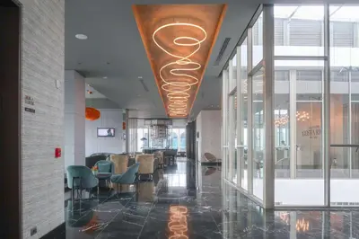 a lobby of a building with chairs and a ceiling at Gran Hotel Costa Rica, Curio Collection By Hilton in San José